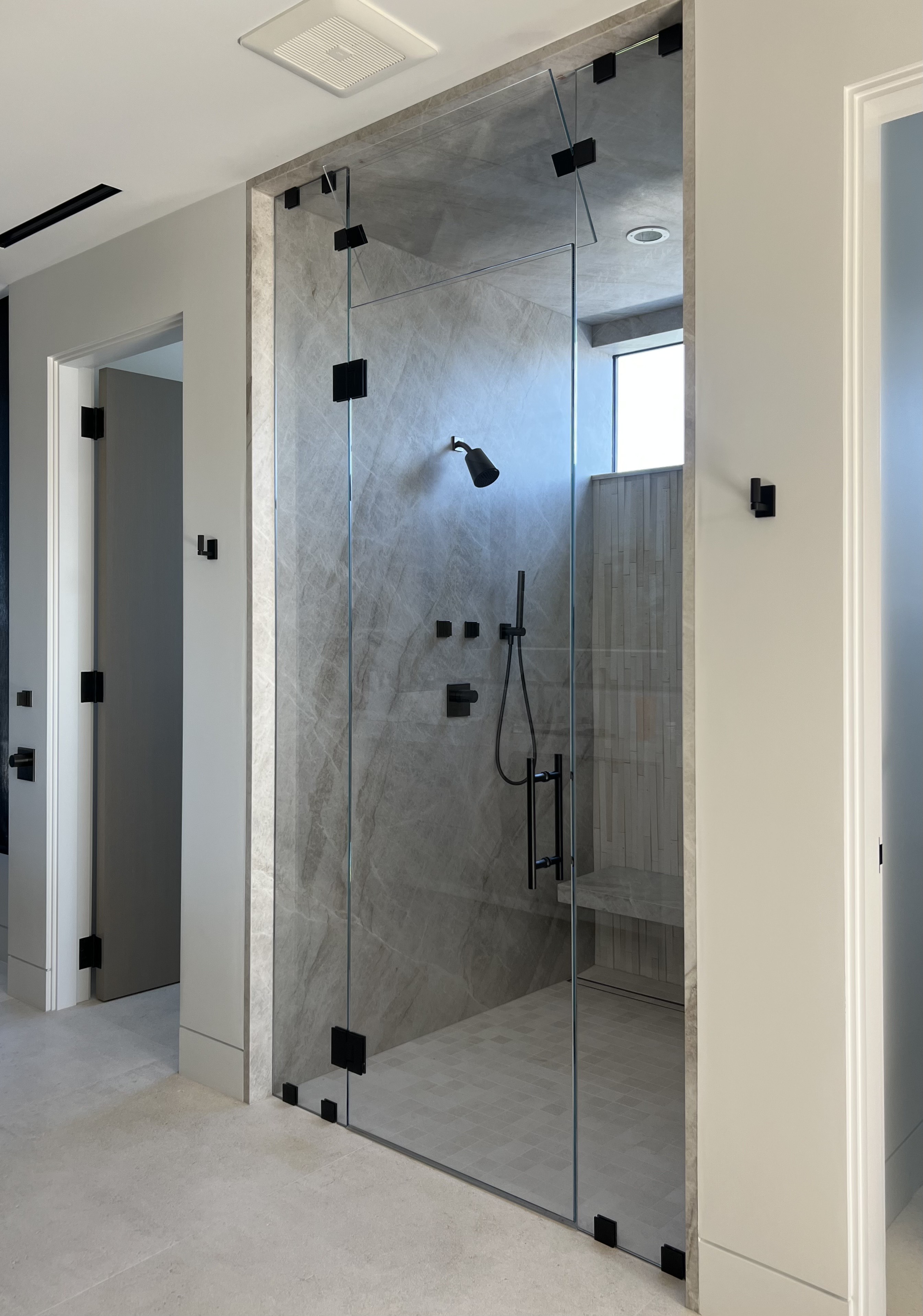 Full-height shower enclosure with matte black hardware